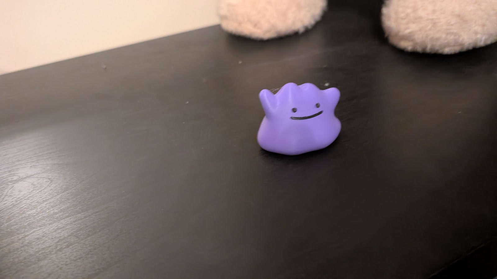 Finished purple Ditto with a small smile on a shelf