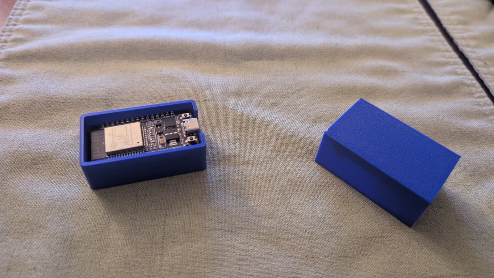 Blue printed ESP32 enclosure with its board and separate lid