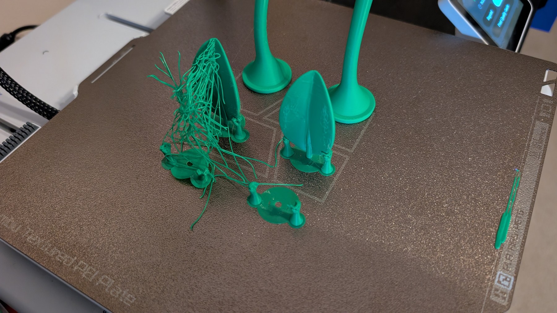 Failed green Sprout print with tangled filament on the build plate