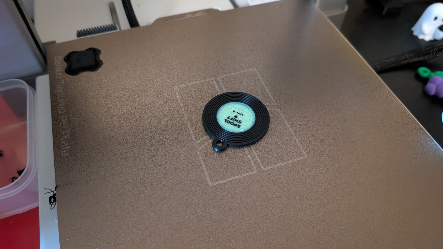 Record-shaped NFC test keyring on the A1 build plate