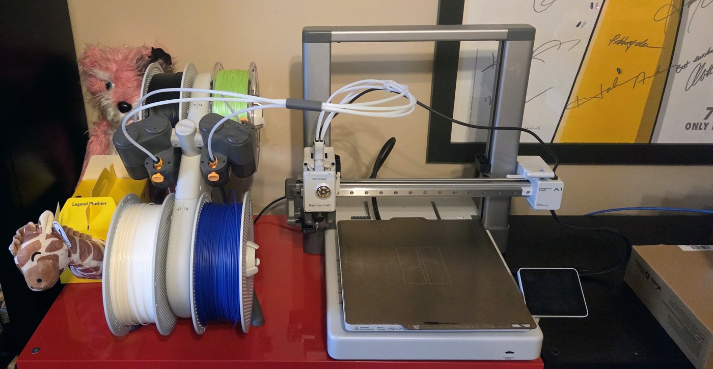 Reassembled AMS Lite with filament loaded beside the A1