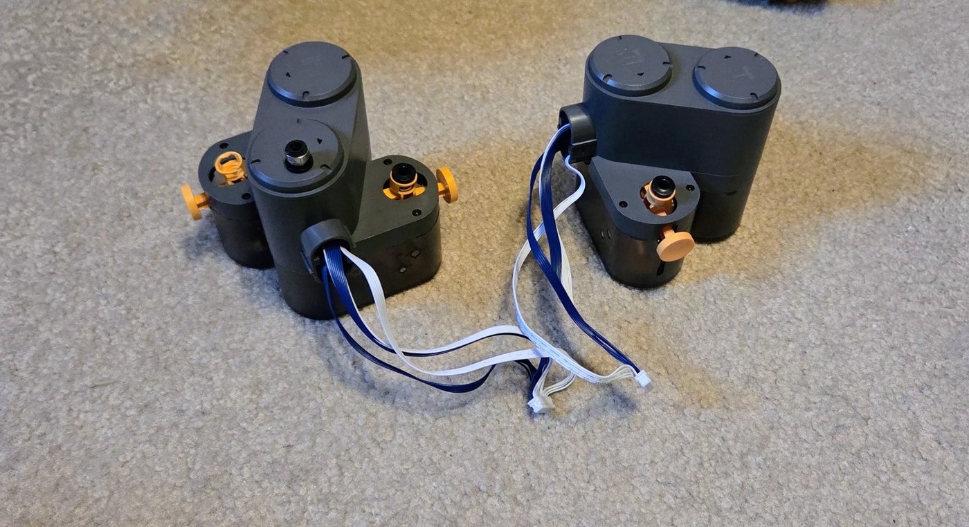 Removed and replacement AMS Lite feeder units side by side