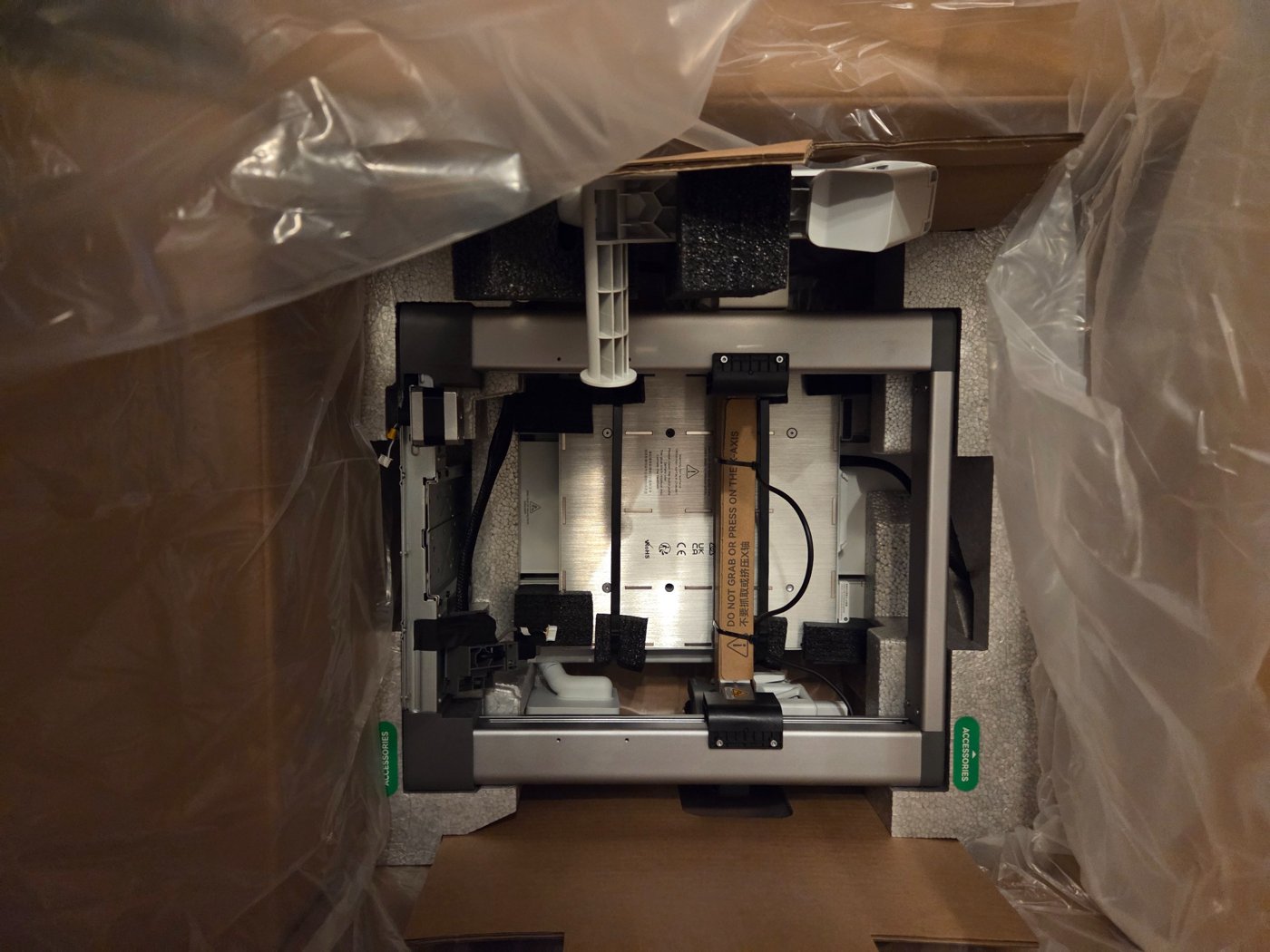 Bambu Lab A1 printer frame revealed inside the opened box